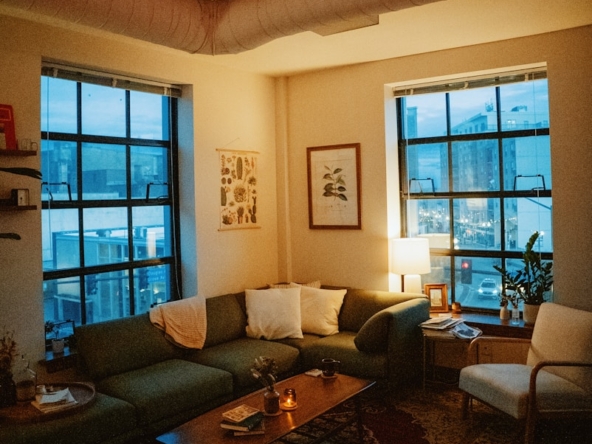 a living room filled with furniture and a fire place