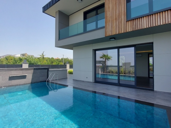 a house with a swimming pool in front of it