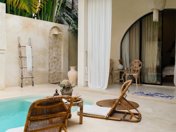 A pool with a chair and a table next to it