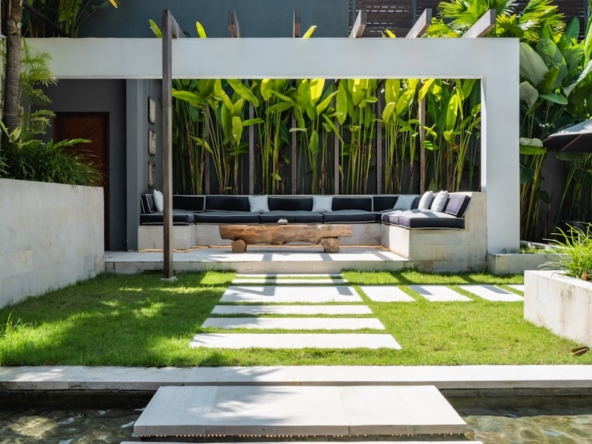 A modern house with a pool in front of it