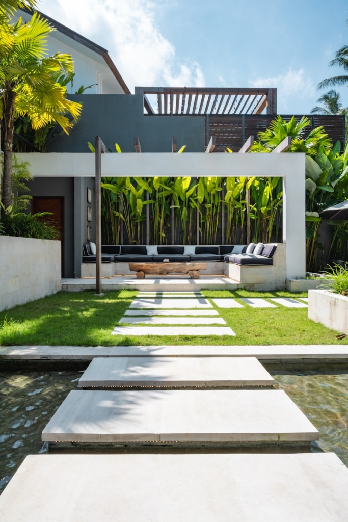 A modern house with a pool in front of it