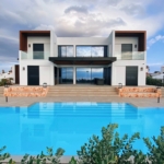 white and brown house near swimming pool