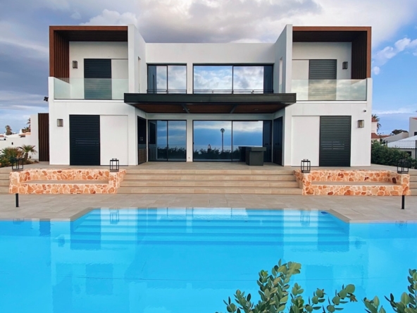white and brown house near swimming pool